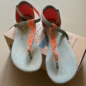 Tom’s grey and  neon orange sandals